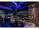 Luxurious living room showcasing a massive screen, comfortable seating, and captivating city views at night at 4575 Dean Martin Dr # 1909, Las Vegas, NV 89103