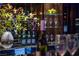 Elegant wet bar featuring sleek countertops, curated glassware, and beverage selections displayed on floating shelves at 4575 Dean Martin Dr # 1909, Las Vegas, NV 89103