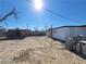View of the backyard featuring block walls, desert landscaping, and a small storage shed at 4808 Everman Dr, Las Vegas, NV 89122
