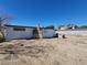 Back view of a single-story home and chimney, set in a backyard with desert landscaping at 4808 Everman Dr, Las Vegas, NV 89122
