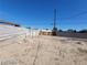 The spacious, enclosed backyard presents desert landscaping with block walls and potential at 4808 Everman Dr, Las Vegas, NV 89122