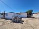 A view of a spacious backyard showcasing desert landscaping and block walls for privacy at 4808 Everman Dr, Las Vegas, NV 89122