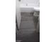 A bathroom with grey vinyl flooring, a bathtub, and a toilet at 4808 Everman Dr, Las Vegas, NV 89122