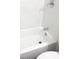 A white bathtub with chrome faucet and white subway tile at 4808 Everman Dr, Las Vegas, NV 89122