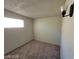 A well lit bedroom with a neutral color palette at 4808 Everman Dr, Las Vegas, NV 89122