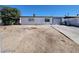 Single-story home with desert landscaping, driveway, and attached garage, showcasing curb appeal and potential at 4808 Everman Dr, Las Vegas, NV 89122