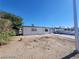 Exterior view of a single-story home with desert landscaping, featuring an attached garage at 4808 Everman Dr, Las Vegas, NV 89122
