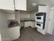 Spacious kitchen with white cabinets, granite countertops, and modern appliances at 4808 Everman Dr, Las Vegas, NV 89122