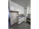Kitchen with white cabinets and granite countertops, providing ample prep space at 4808 Everman Dr, Las Vegas, NV 89122