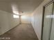 An empty bonus room with a small window and sliding glass door at 4808 Everman Dr, Las Vegas, NV 89122