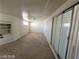 An empty bonus room with built-in shelving and a sliding glass door at 4808 Everman Dr, Las Vegas, NV 89122