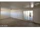 An empty bonus room with two doors and a sliding glass door at 4808 Everman Dr, Las Vegas, NV 89122