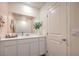 Bright bathroom with white vanity, and pink walls at 5011 Sage Mesa Ave # Lot 143, Las Vegas, NV 89139