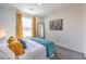 Bright bedroom featuring a stylish bed, colorful decor, and exterior views at 5011 Sage Mesa Ave # Lot 143, Las Vegas, NV 89139