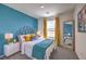 Bright bedroom featuring a stylish bed, colorful decor, and natural light at 5011 Sage Mesa Ave # Lot 143, Las Vegas, NV 89139