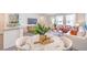Elegant dining area with seating and an open layout into living room and kitchen at 5011 Sage Mesa Ave # Lot 143, Las Vegas, NV 89139