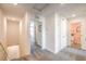 Upstairs hallway with neutral carpet and access to multiple rooms and bathrooms at 5011 Sage Mesa Ave # Lot 143, Las Vegas, NV 89139