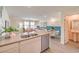 Modern kitchen flows into dining and living area with plenty of natural light at 5011 Sage Mesa Ave # Lot 143, Las Vegas, NV 89139