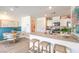 Bright open kitchen features quartz counters, breakfast bar and adjacent dining area at 5011 Sage Mesa Ave # Lot 143, Las Vegas, NV 89139