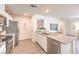 Bright kitchen with stainless appliances, sleek counter tops and open to living area at 5011 Sage Mesa Ave # Lot 143, Las Vegas, NV 89139
