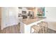 Bright kitchen features stainless appliances, quartz counters, and breakfast bar with seating at 5011 Sage Mesa Ave # Lot 143, Las Vegas, NV 89139