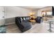 Bright living room with a plush sectional sofa, balcony access, and modern decor at 5020 Indian River Dr # 424, Las Vegas, NV 89103