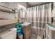 A compact bathroom with a shower, toilet, and modern vanity at 5112 Pebble Beach Blvd, Las Vegas, NV 89108