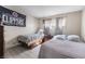 Bright bedroom featuring two twin beds and a window with natural light at 5112 Pebble Beach Blvd, Las Vegas, NV 89108