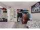 A bedroom with a TV, closet and ensuite bathroom at 5112 Pebble Beach Blvd, Las Vegas, NV 89108