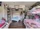 Cozy bedroom featuring a white-framed bed, wooden floors, and whimsical decor at 5112 Pebble Beach Blvd, Las Vegas, NV 89108