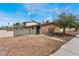 Exterior shot of a residential building with gravel landscaping, block wall, and a view of the surrounding area at 5112 Pebble Beach Blvd, Las Vegas, NV 89108