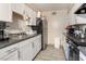 Well-lit kitchen with stainless steel appliances and white cabinets at 5112 Pebble Beach Blvd, Las Vegas, NV 89108