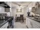 Bright eat-in kitchen featuring white cabinets and modern appliances at 5112 Pebble Beach Blvd, Las Vegas, NV 89108