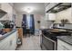 Functional kitchen featuring modern appliances and a dining area at 5112 Pebble Beach Blvd, Las Vegas, NV 89108