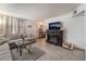 Cozy living room with a fireplace and mounted tv at 5112 Pebble Beach Blvd, Las Vegas, NV 89108