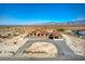 Aerial view of desert home with a circular driveway at 5700 E Carter Ln, Pahrump, NV 89061