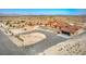 Expansive desert property featuring a sprawling home with a terracotta roof and a circular driveway at 5700 E Carter Ln, Pahrump, NV 89061
