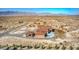 Birds eye view of the house and its surrounding desert landscape at 5700 E Carter Ln, Pahrump, NV 89061