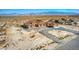 Spacious desert property featuring a home with a terracotta roof, circular driveway, and RV parking at 5700 E Carter Ln, Pahrump, NV 89061