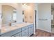 Bright bathroom features a double vanity, and a walk-in glass shower at 5700 E Carter Ln, Pahrump, NV 89061