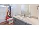 Modern bathroom featuring sleek vanity and shower-tub combination at 5700 E Carter Ln, Pahrump, NV 89061