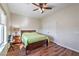 Charming bedroom features a ceiling fan, closet, and bright natural light at 5700 E Carter Ln, Pahrump, NV 89061