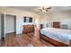 Bright bedroom featuring generous closet space and modern ceiling fan at 5700 E Carter Ln, Pahrump, NV 89061