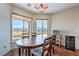 Cozy dining area with scenic views from large windows at 5700 E Carter Ln, Pahrump, NV 89061