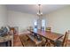 Formal dining room boasts stylish chandelier and rustic wooden table at 5700 E Carter Ln, Pahrump, NV 89061