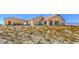 Sprawling single-story home featuring desert landscaping and mountain views at 5700 E Carter Ln, Pahrump, NV 89061