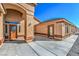 Inviting front entrance showcasing the covered porch and decorative front door at 5700 E Carter Ln, Pahrump, NV 89061