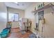 Well-equipped laundry room with modern appliances and storage shelves at 5700 E Carter Ln, Pahrump, NV 89061