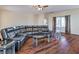 Spacious living room showcasing hardwood floors and a large sectional couch at 5700 E Carter Ln, Pahrump, NV 89061