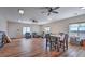 Large living area features wood flooring, abundant lighting, and multiple seating areas at 5700 E Carter Ln, Pahrump, NV 89061